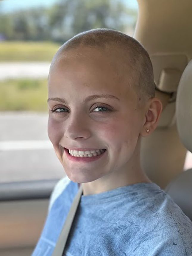 Smiling young cancer survivor