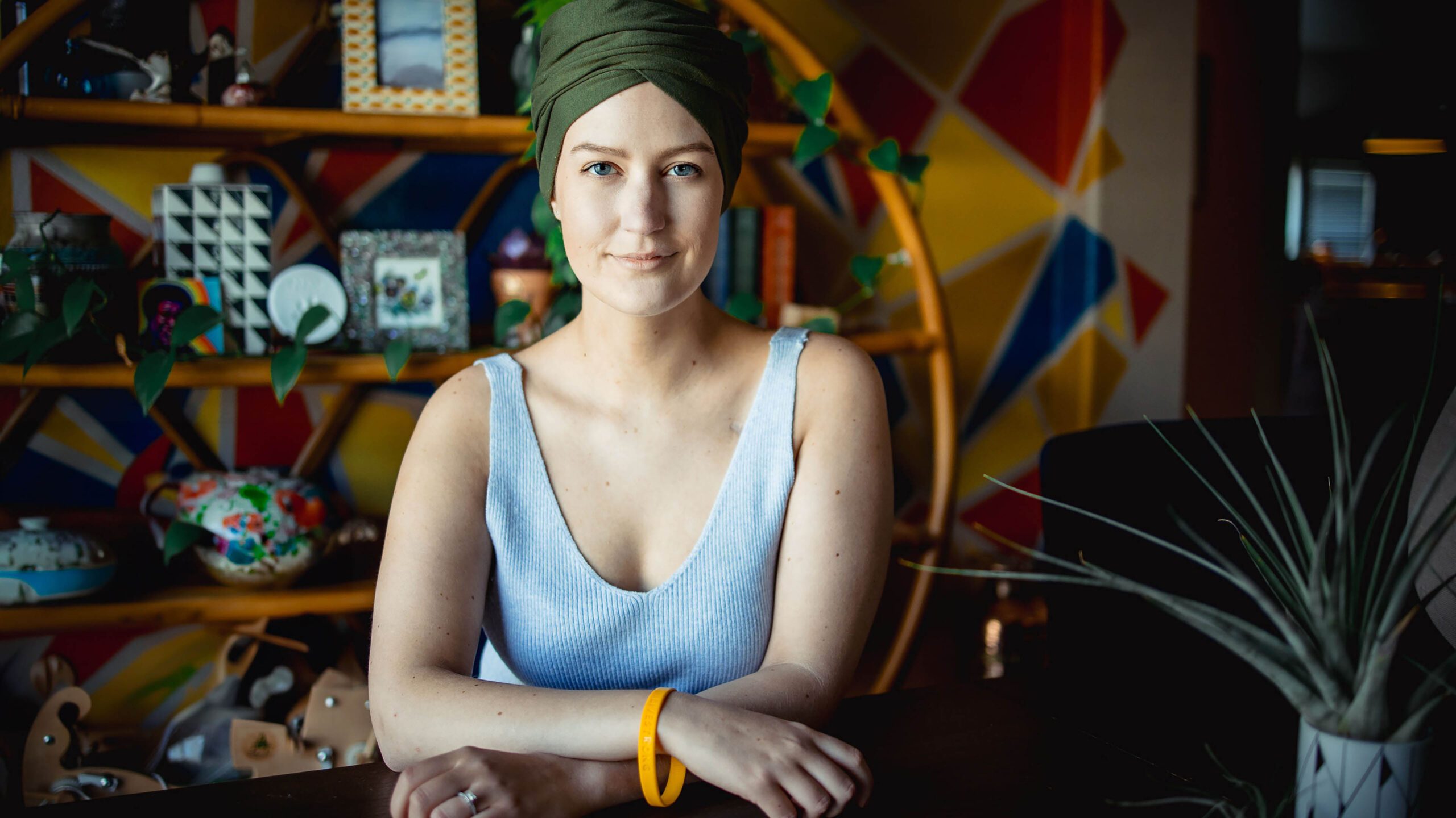 Portrait of a cancer survivor wearing a Livestrong wristband