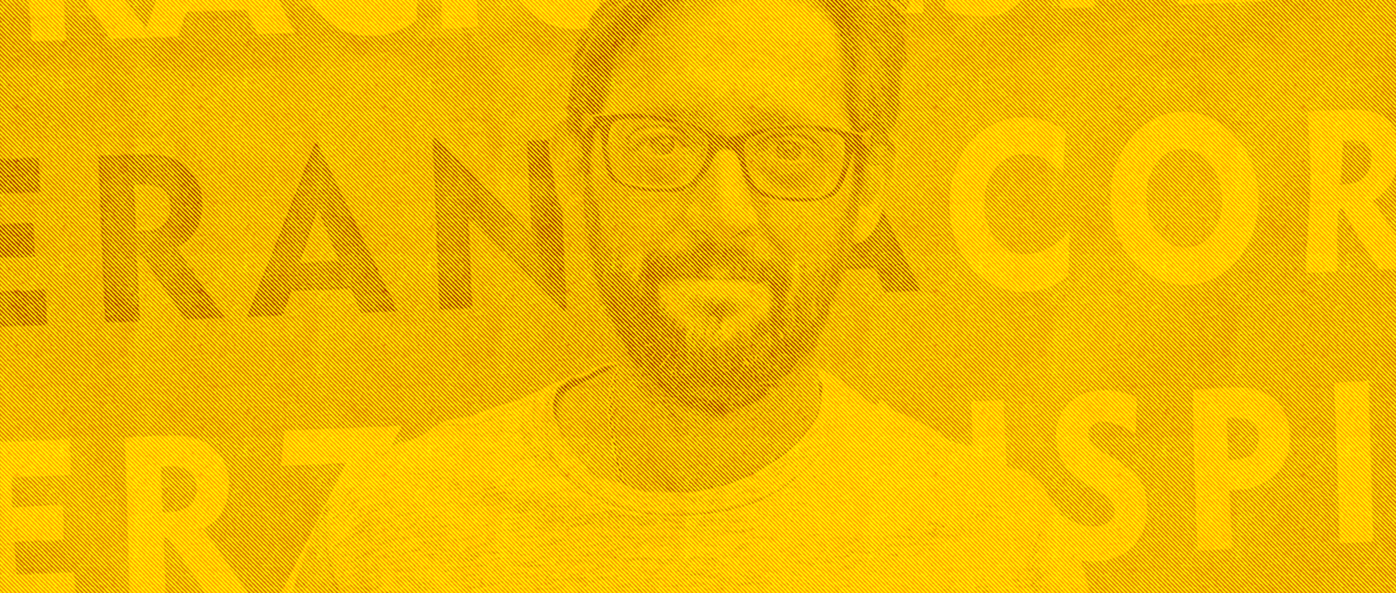 A man with glasses posing against a yellow backdrop