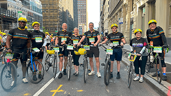 Livestrong cyclists posing for a team photo on the streets of New York City.