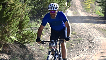 Mountain biker on gravel trail in Leadville, CO.