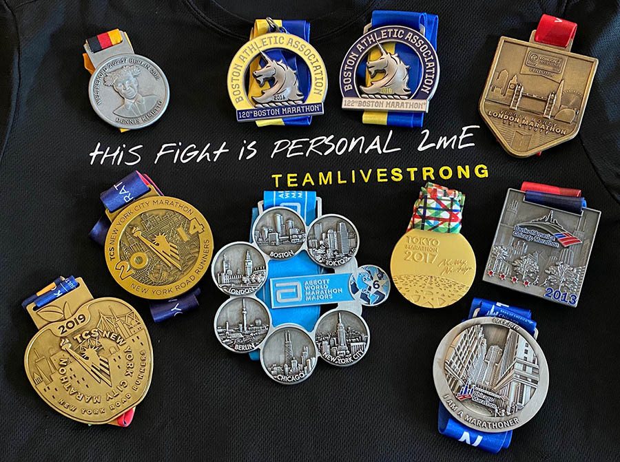 Medals laid out on a black background