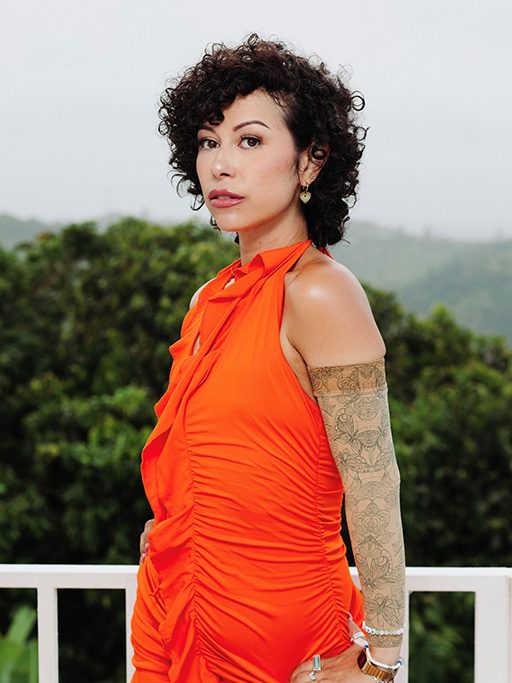 A portrait of a woman with trees in the background