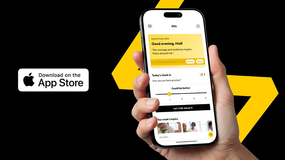 Hand holding a smartphone viewing a cancer support app