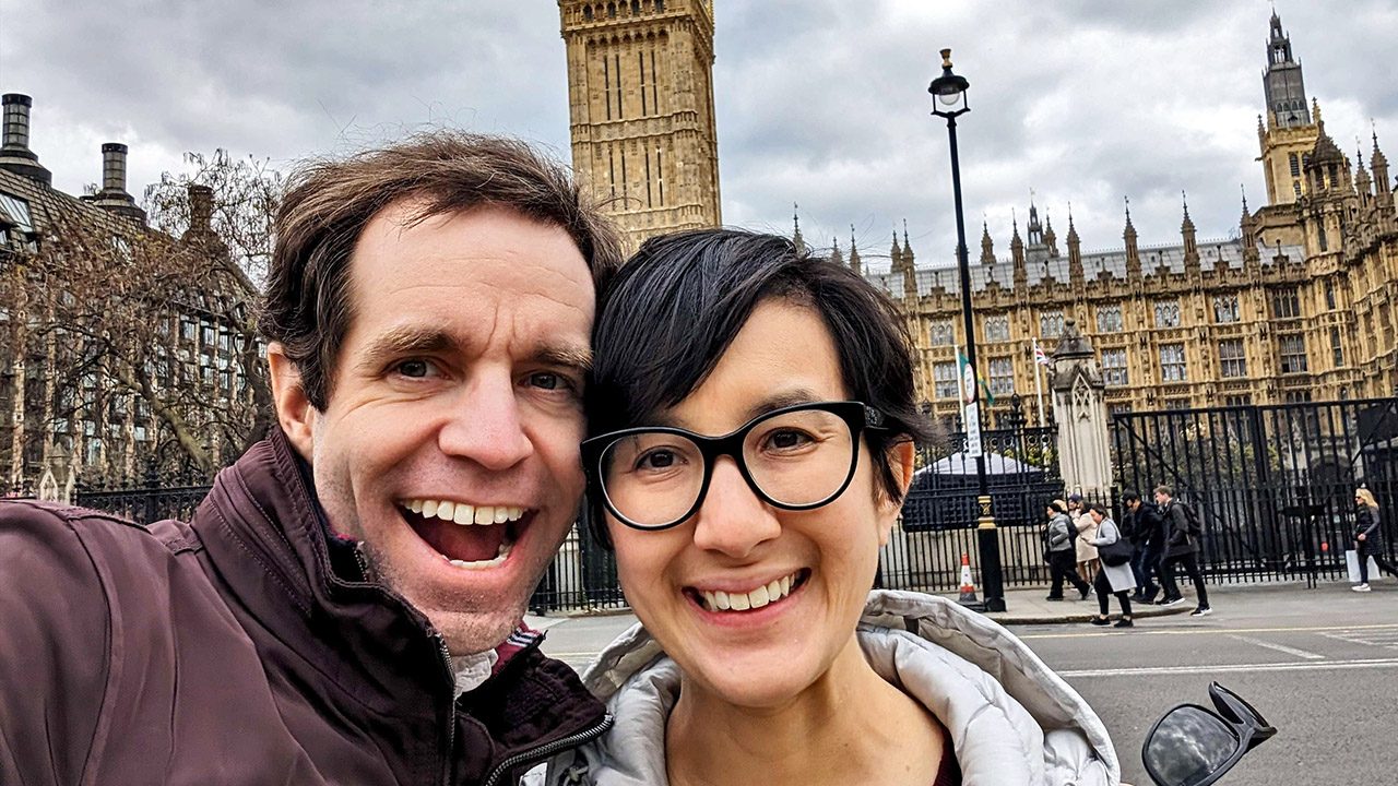 Selfie of a couple in front of a landmark building