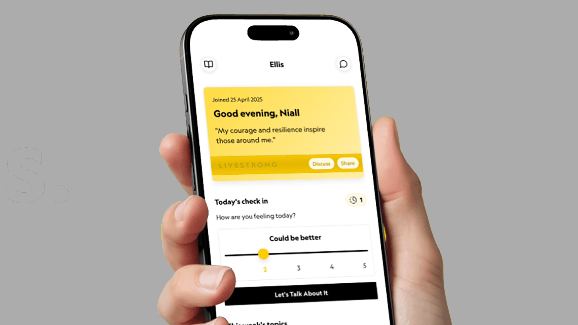 Hand holding a smartphone using a cancer support app