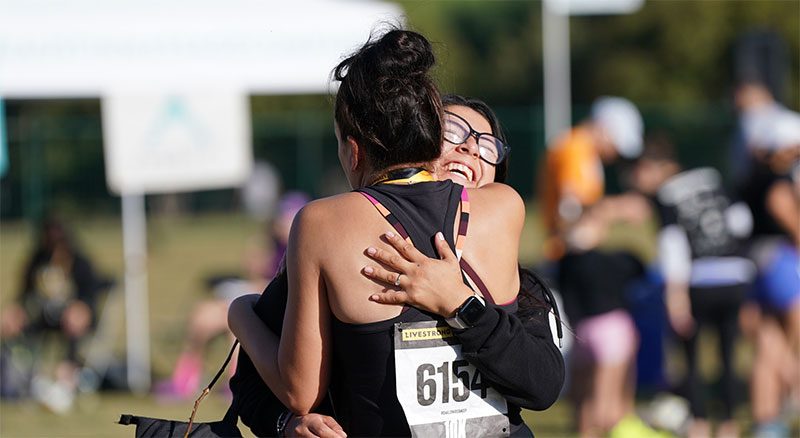 Two women embracing during a Livestrong Event