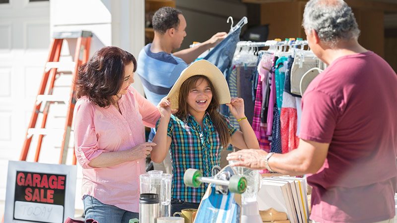 Mother and daughter at a garage sale