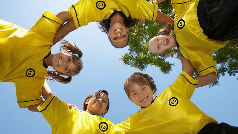 Group of young girls with Livestrong team soccer jerseys