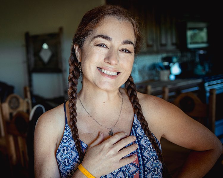 Smiling adult woman at home