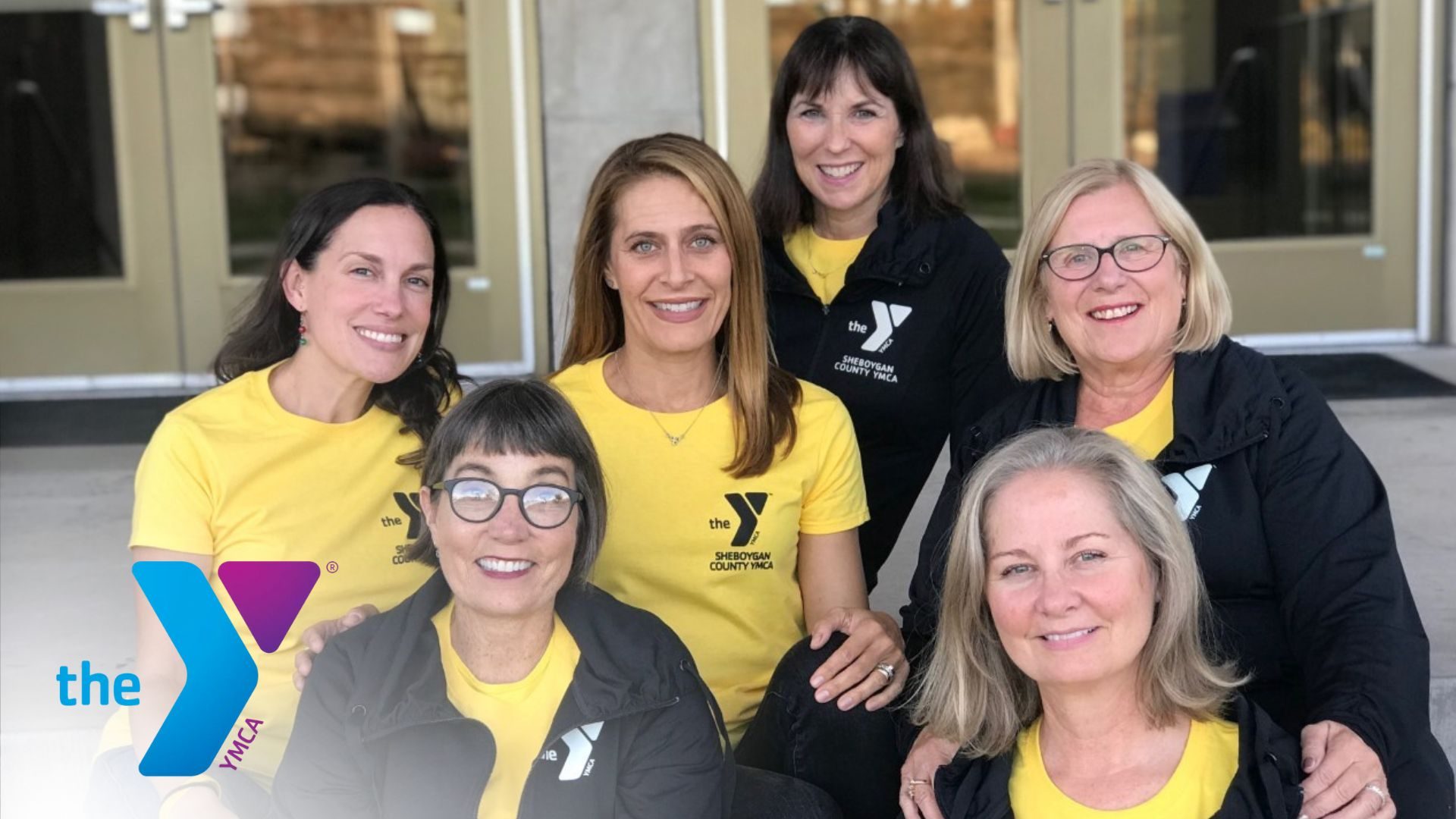 A group of women in YMCA uniforms