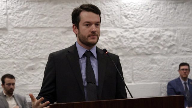 A man speaking at a podium